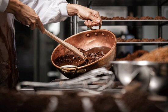 Chocolatier pouring chocolate